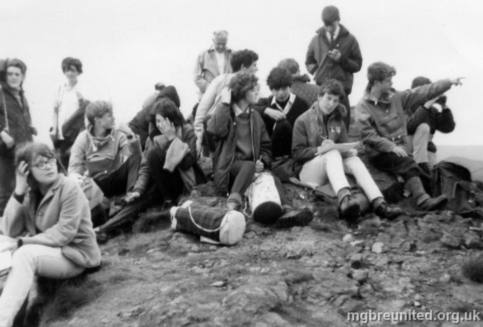 1964 ? Winn Hill Derbyshire This is the Geography Field Trip to Winn Hill Derbyshire overlooking the Ladybower Reservoir. LEFT to RIGHT: STANDING: Michael Price?, SITTING: Jennifer Pugsley, GIRL STANDING AT BACK: dk, SITTING: dk boy, Susan Wyles? (hand in front of face), STANDING, Mr Czyntak (or could it be Mr Upperdine?) John Simpson, Susan Matthews, Keith Titman, John Howitt (writing), STANDING: dk, Fred Plumb (pointing)