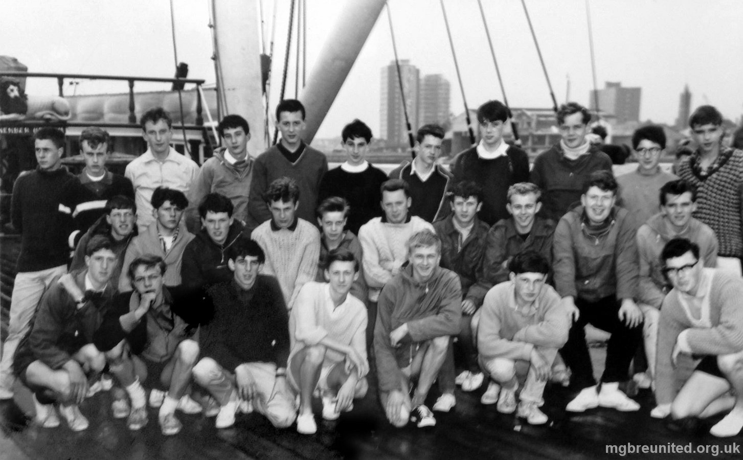 1963 Trip to HMS Foudroyant BACK ROW: 1 Chris Gaulton (Golly) watching the ships, 2 Robert Rutt, 3 ? Townend, 4 Chris Hall (Ozzie), 5 Mick Morrell, 6 Tommy Glanz, 7 ?, 8 Dave Wright, 9 John Pinder, 10 Tony Rouse, 11 Paul Brown. MIDDLE ROW :1 ?, 2 ?, 3 Trevor Vickers, 4 Ray Scott, 5 ? Green, 6 Mr Clarke, 7 Dave Waldron (Wally), 8 Roy Davies (Great Footballer), 9 John Fletcher (Fletch), 10 Allan Woodiwiss, FRONT ROW: 1 Annesley Clifford, 2 Adrian Foulkes, 3 Richard Smith (Smiffy), 4 ?, 5 David Fountain, 6 Dave Holland (Holly), 7 ?.