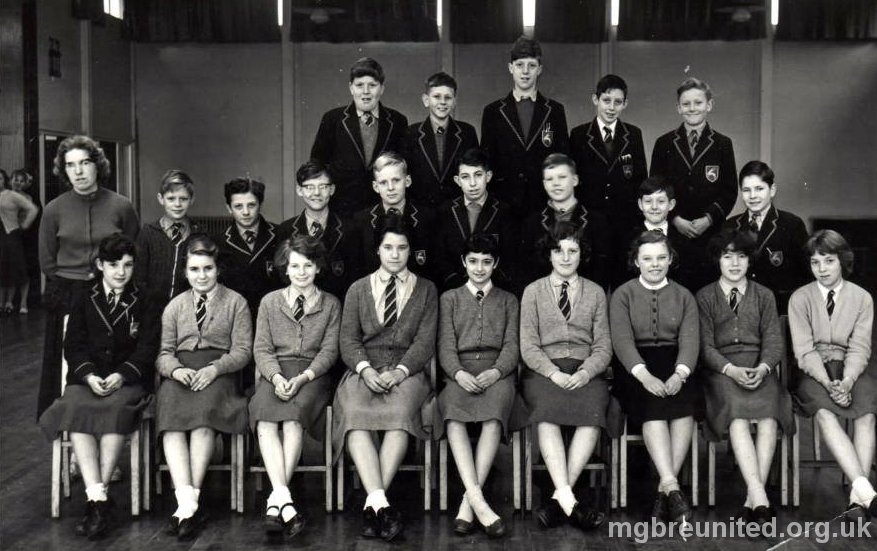 1964 ? Class Photo in the School Hall BACK ROW: 1 John Fletcher ,2 dk, 3 John Broomhead, 4 dk 5 Stephen Nuttall MIDDLE ROW: 1 Teacher, 4 Peter Towsey , 8 Terry Briggs FRONT ROW: 1 Kathy Cope, 2 Chris Wiley, 3 Lynn rhymes, 4 Chris Clements, 5 Jacqueline Dean, 6 Ann Rowe? 8 Kathleen Hill, 9 Ann Jeffery. Names From Chris Gaulton Top Left John Fletcher, ? Annesley Clifford, Tony Allen, Graham White. Middle left Glyn Collins, Dave Waldram, ? ? Gordon Clifford, Barry Sloan, ? ? Front Left ? Possibly Irene Monks, Lynne Rymes, Christine something, Jaqualine Dean, Possibly Carrol Eggleton, ? ? ?